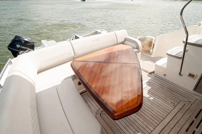 Lady Gail Yacht Photos Pics Luxurious 2018 Sea Ray L550 Flybridge yacht with elegant wooden table and comfortable seating.