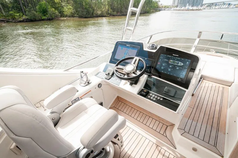 Lady Gail Yacht Photos Pics 2018 Sea Ray L550 Flybridge helm with modern controls and river view.