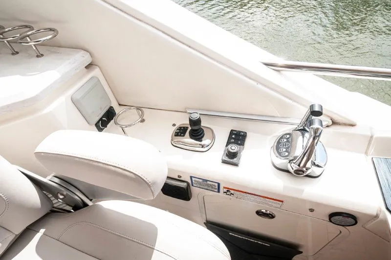 Lady Gail Yacht Photos Pics 2018 Sea Ray L550 Flybridge helm with controls and seating, overlooking water.
