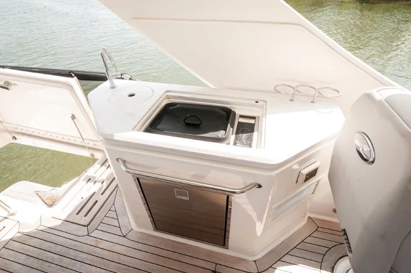 Lady Gail Yacht Photos Pics 2018 Sea Ray L550 Flybridge yacht with outdoor kitchenette and sink on deck.