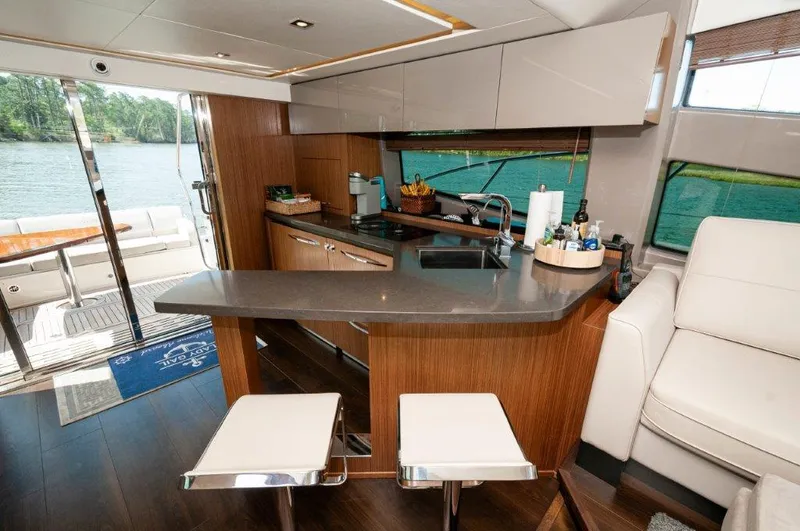 Lady Gail Yacht Photos Pics Luxurious 2018 Sea Ray L550 Flybridge yacht interior with modern kitchen and lake view.