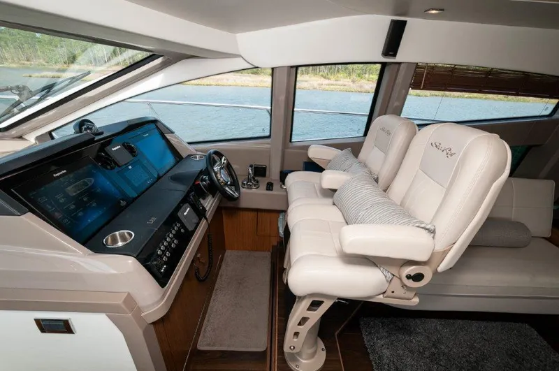 Lady Gail Yacht Photos Pics 2018 Sea Ray L550 Flybridge yacht interior with modern helm and luxurious seating.