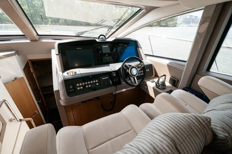 Lady Gail Yacht Photos Pics 2018 Sea Ray L550 Flybridge helm with modern controls and plush seating.