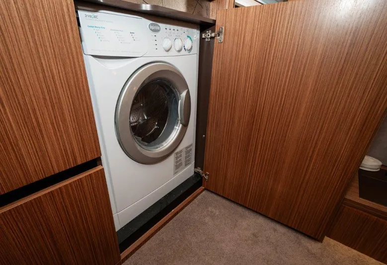 Lady Gail Yacht Photos Pics Washing machine in 2018 Sea Ray L550 Flybridge yacht's wooden cabinet.