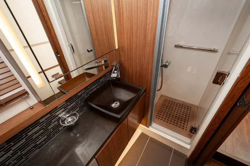 Lady Gail Yacht Photos Pics Luxurious bathroom in 2018 Sea Ray L550 Flybridge yacht with modern sink and shower.