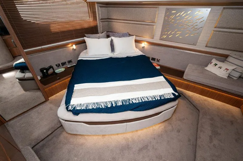 Lady Gail Yacht Photos Pics Luxurious bedroom interior of 2018 Sea Ray L550 Flybridge yacht with modern decor.