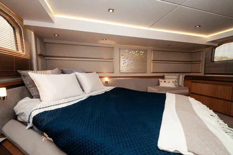 Lady Gail Yacht Photos Pics Luxurious bedroom interior of 2018 Sea Ray L550 Flybridge yacht with elegant bedding.