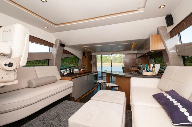 Lady Gail Yacht Photos Pics Luxurious interior of 2018 Sea Ray L550 Flybridge yacht with modern furnishings and scenic views.