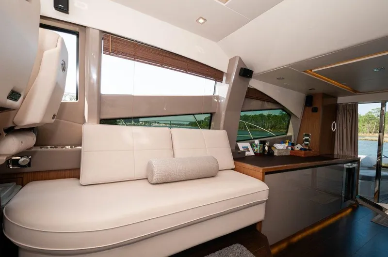 Lady Gail Yacht Photos Pics Luxurious interior of 2018 Sea Ray L550 Flybridge yacht with modern seating and large windows.