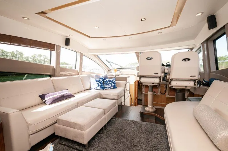 Lady Gail Yacht Photos Pics Luxurious interior of 2018 Sea Ray L550 Flybridge yacht with plush seating and modern design.