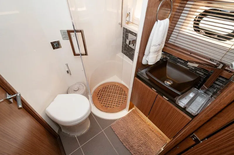 Lady Gail Yacht Photos Pics Luxurious bathroom in 2018 Sea Ray L550 FLYBRIDGE yacht with modern fixtures and elegant design.