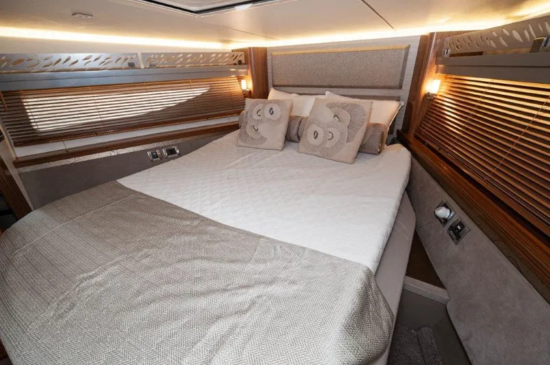 Lady Gail Yacht Photos Pics Luxurious bedroom interior of 2018 Sea Ray L550 Flybridge yacht with elegant bedding.