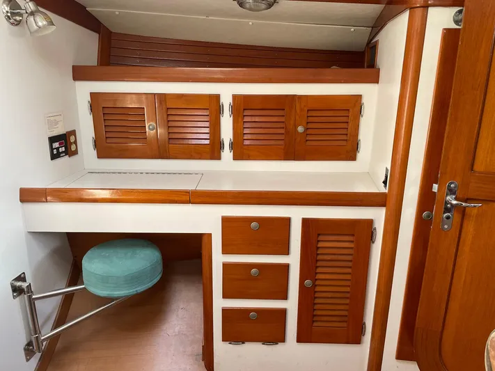 Condor Yacht Photos Pics Interior of 1996 J Boats J/160 with wooden cabinets and seating.
