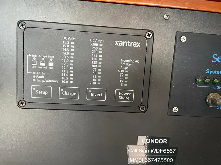 Condor Yacht Photos Pics Electrical control panel on a 1996 J Boats J/160, featuring Xantrex system indicators.