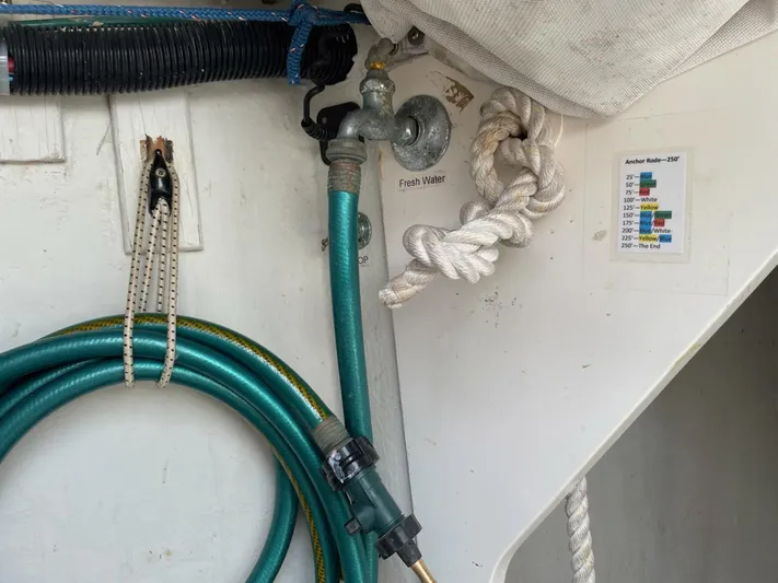 Condor Yacht Photos Pics Freshwater hose and ropes on a 1996 J Boats J/160 sailboat.