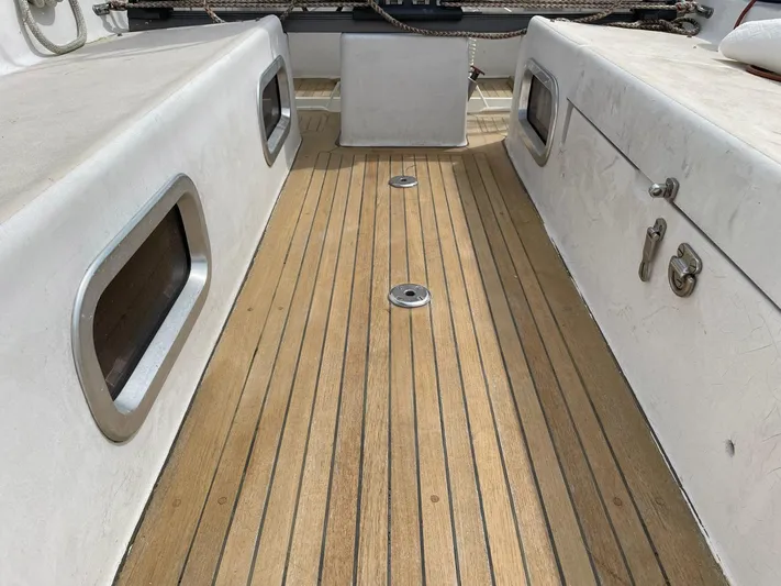 Condor Yacht Photos Pics Teak deck of 1996 J Boats J/160 sailboat, featuring sleek design and stainless steel fittings.