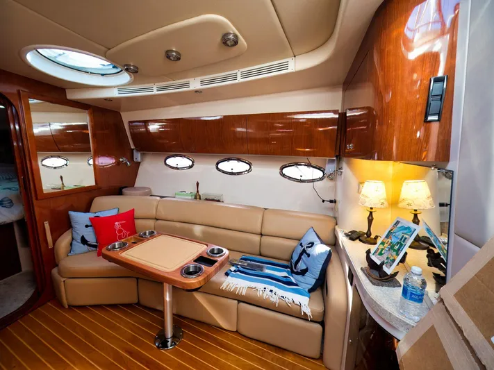 Syrenka Yacht Photos Pics Luxurious 2008 Regal Commodore 4060 yacht interior with plush seating and elegant wood finishes.