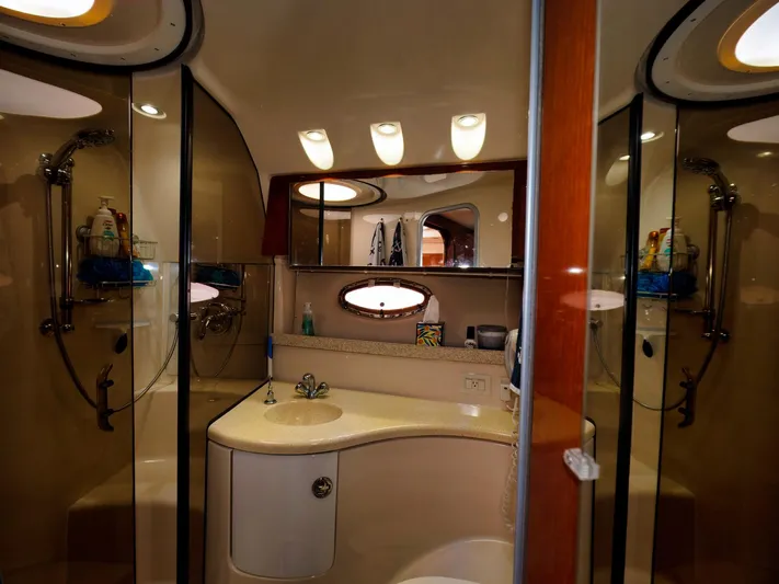 Syrenka Yacht Photos Pics Luxurious bathroom in 2008 Regal Commodore 4060 yacht with modern fixtures and elegant design.