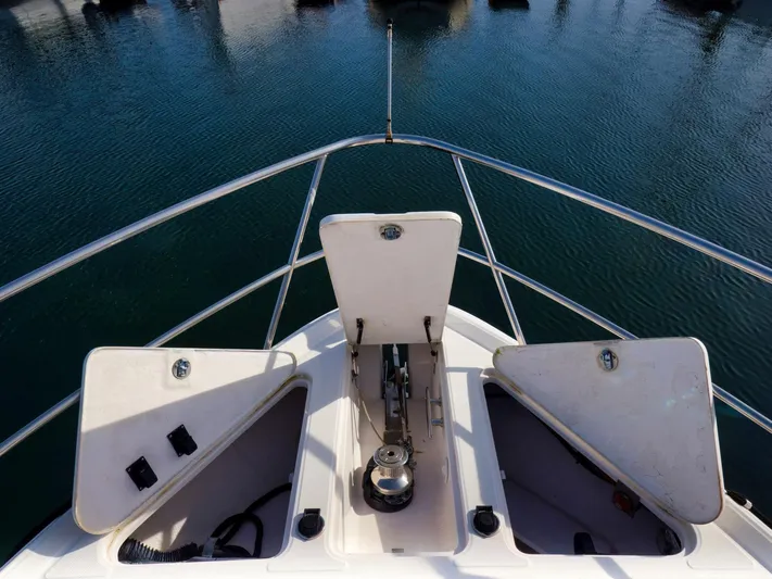 Syrenka Yacht Photos Pics Bow view of 2008 Regal Commodore 4060 yacht with open storage compartments.