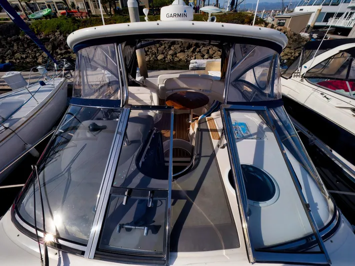 Syrenka Yacht Photos Pics 2008 Regal Commodore 4060 yacht with Garmin equipment, docked in a marina.