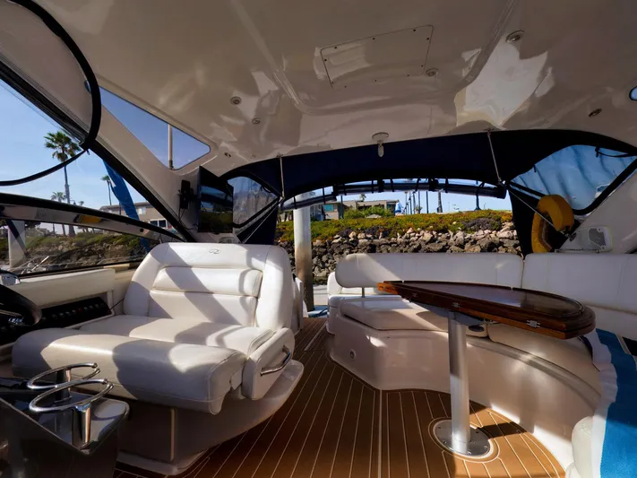 Syrenka Yacht Photos Pics Interior of 2008 Regal Commodore 4060 yacht with luxurious seating and wooden flooring.