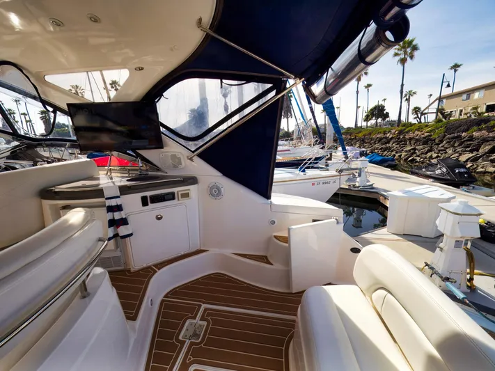 Syrenka Yacht Photos Pics 2008 Regal Commodore 4060 yacht interior with seating, TV, and marina view.