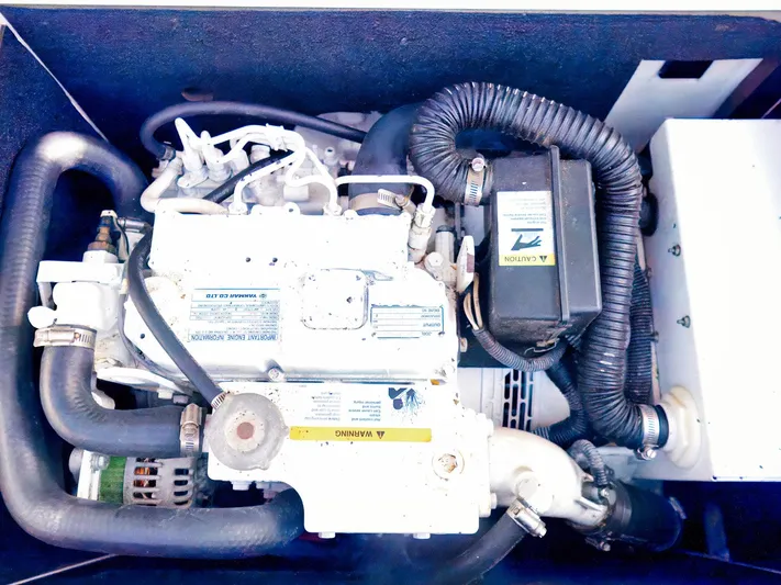 Syrenka Yacht Photos Pics Engine compartment of a 2008 Regal Commodore 4060 boat, showcasing mechanical components.