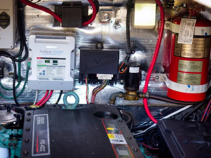 Syrenka Yacht Photos Pics Engine room of 2008 Regal Commodore 4060 with electrical components and fire extinguisher.