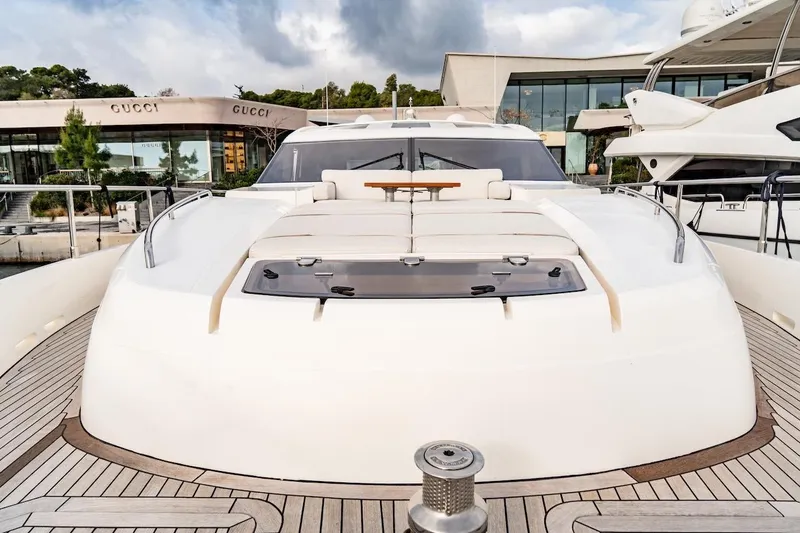  Yacht Photos Pics Luxurious 2012 Princess V72 yacht docked near upscale shopping area.