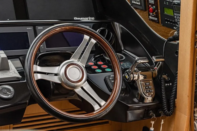  Yacht Photos Pics Steering wheel and controls of a 2012 Princess V72 yacht cockpit.