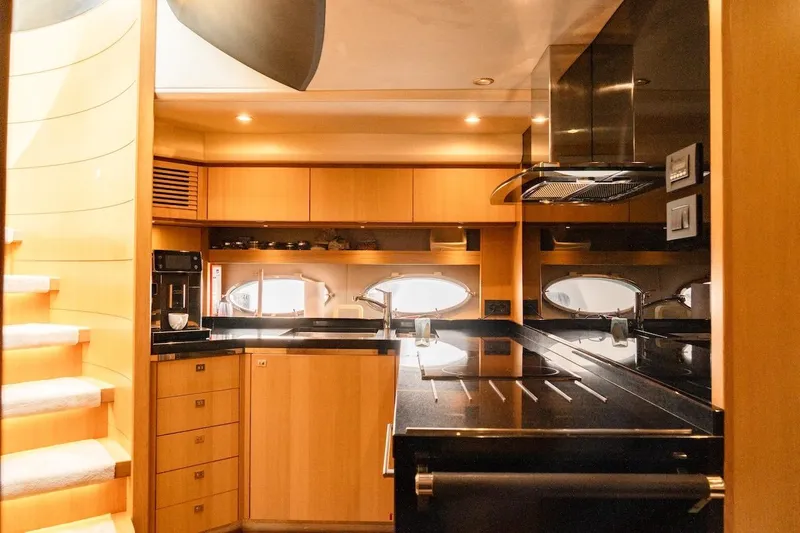  Yacht Photos Pics Luxurious kitchen interior of 2012 Princess V72 yacht with modern appliances and sleek design.