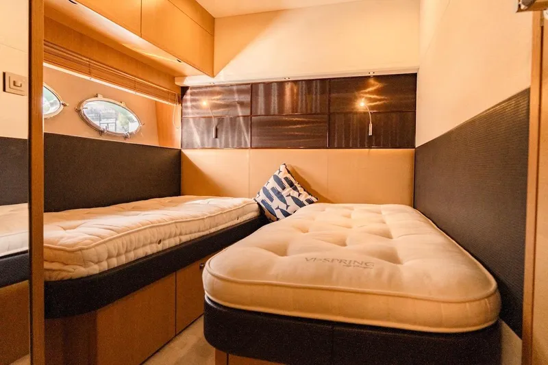  Yacht Photos Pics Luxurious cabin interior of 2012 Princess V72 yacht with twin beds and modern decor.