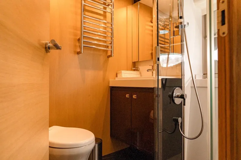  Yacht Photos Pics Luxurious bathroom in 2012 Princess V72 yacht with modern fixtures and wooden accents.