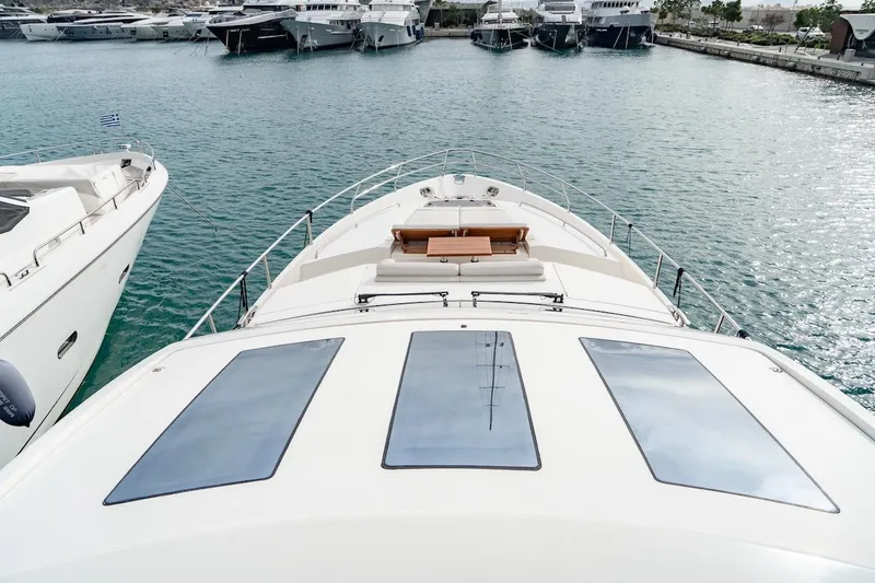  Yacht Photos Pics 2012 Princess V72 yacht docked in marina, surrounded by other luxury boats.