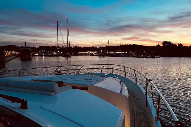  Yacht Photos Pics 2012 Princess V72 yacht at sunset, docked in a serene marina.