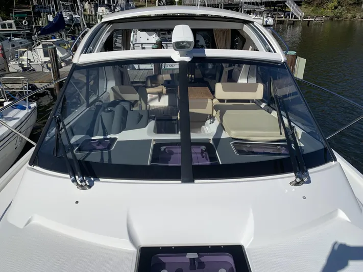  Yacht Photos Pics 2015 Bavaria S36 Coupe boat with spacious cockpit and modern design at a marina.