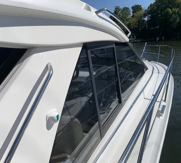  Yacht Photos Pics 2015 Bavaria S36 Coupe yacht side view with sleek design and windows.