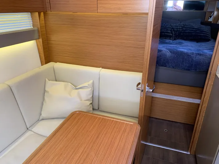  Yacht Photos Pics Interior of 2015 Bavaria S36 Coupe with cozy seating and wooden finishes.