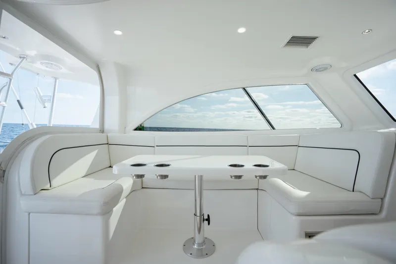 Reelin N Dealin Yacht Photos Pics Luxurious interior of 2018 Viking 37 Billfish yacht with white seating and ocean view.