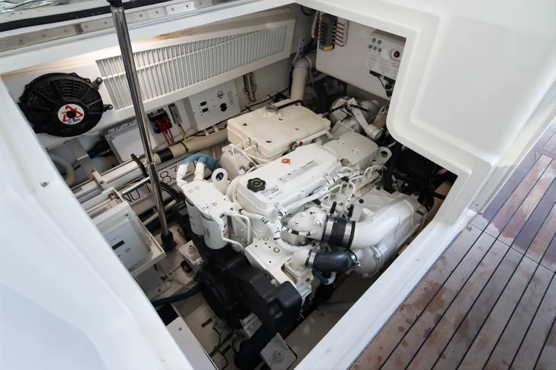 Reelin N Dealin Yacht Photos Pics Engine compartment of 2018 Viking 37 Billfish yacht, showcasing detailed mechanical components.