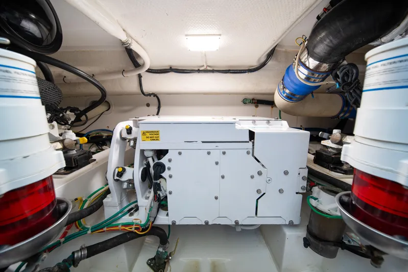 Reelin N Dealin Yacht Photos Pics Engine room of 2018 Viking 37 Billfish boat, showcasing mechanical components and wiring.