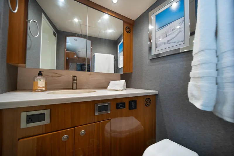 Reelin N Dealin Yacht Photos Pics Luxurious bathroom in 2018 Viking 37 Billfish yacht with modern fixtures and elegant decor.