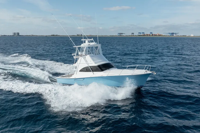 Reelin N Dealin Yacht Photos Pics 2018 Viking 37 Billfish yacht cruising on open water, creating waves.