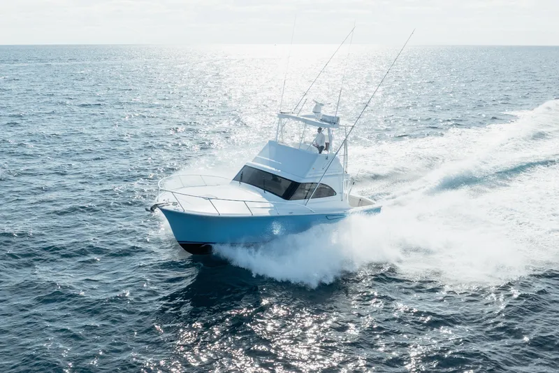 Reelin N Dealin Yacht Photos Pics 2018 Viking 37 Billfish yacht cruising on open ocean waters.