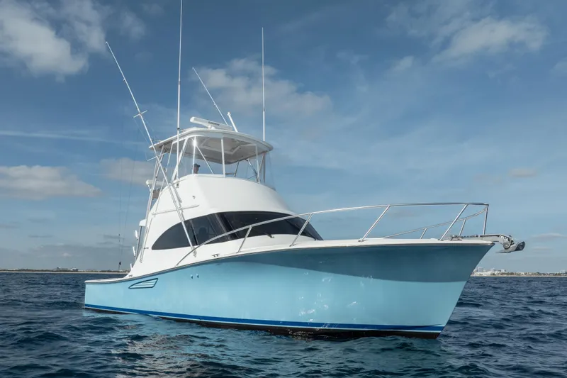 Reelin N Dealin Yacht Photos Pics 2018 Viking 37 Billfish yacht on open water under clear blue sky.