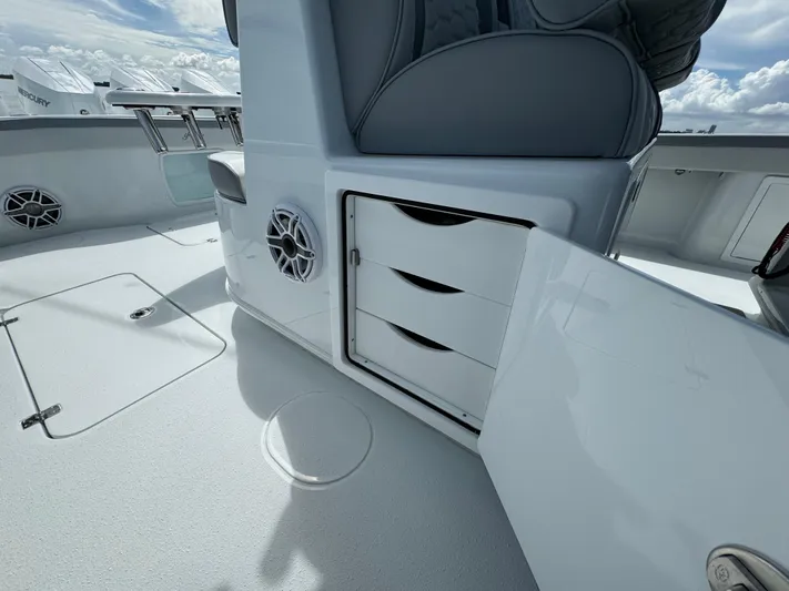  Yacht Photos Pics 2024 Yellowfin 39 boat interior with open storage compartments and seating.