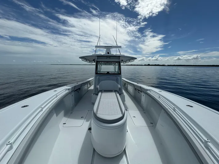  Yacht Photos Pics 2024 Yellowfin 39 boat on calm ocean under a partly cloudy sky.