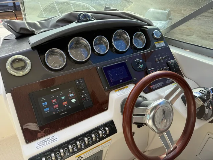 Rollin With The Flow Yacht Photos Pics Dashboard of a 2012 Sea Ray 310 Sundancer boat with gauges and controls.