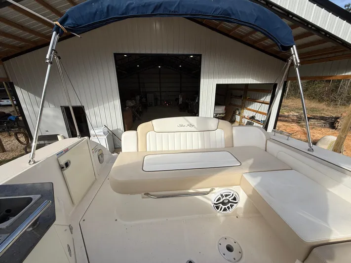 Rollin With The Flow Yacht Photos Pics 2012 Sea Ray 310 Sundancer boat interior with seating and canopy.