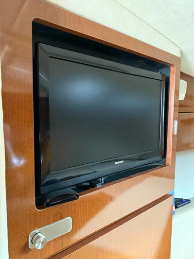 Rollin With The Flow Yacht Photos Pics Flat-screen TV in 2012 Sea Ray 310 Sundancer yacht interior.